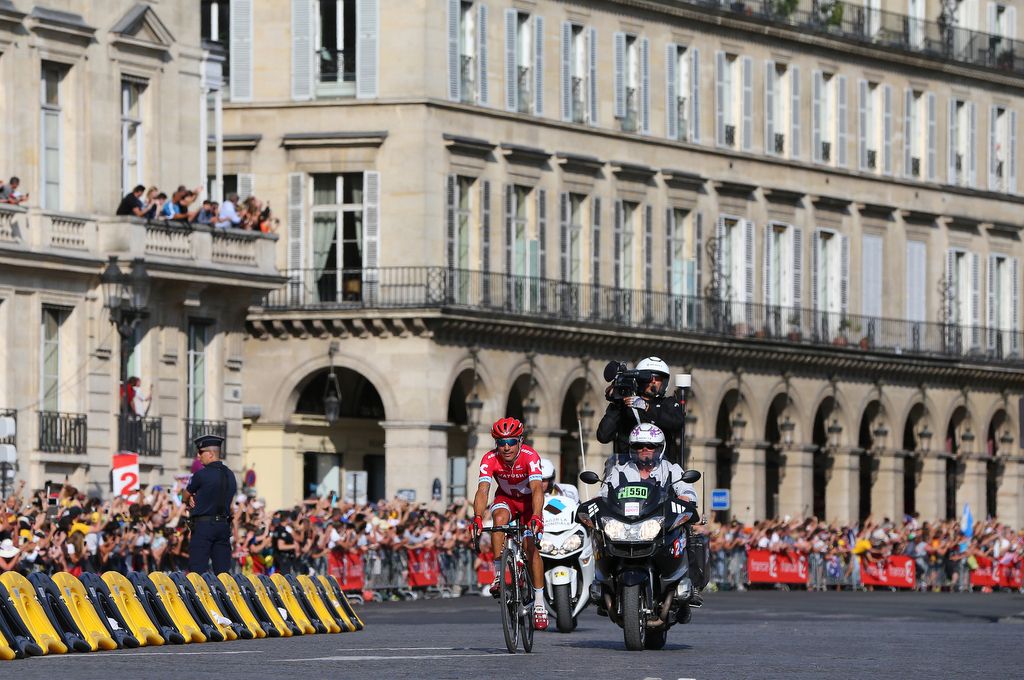 Joaquim Rodriguez (Katusha) basks in the Parisian sunlight as he leads the peloton onto the Champs-Elysees
