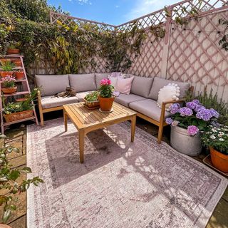 outdoor patio with garden furniture and outdoor rug