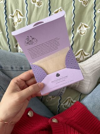 Mica Ricketts holding Tatcha Aburatorigami Blotting Papers