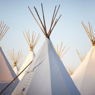 white tent made with sticks