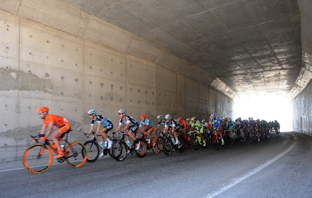 The peloton passes through a tunnel during stage 5.