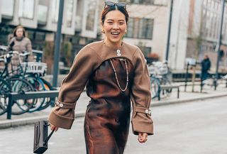 woman in brown jacket and dress