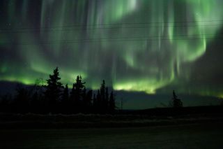 The aurora dances high in the sky over Murphy Dome, Alaska, early in the morning on April 11, 2012.