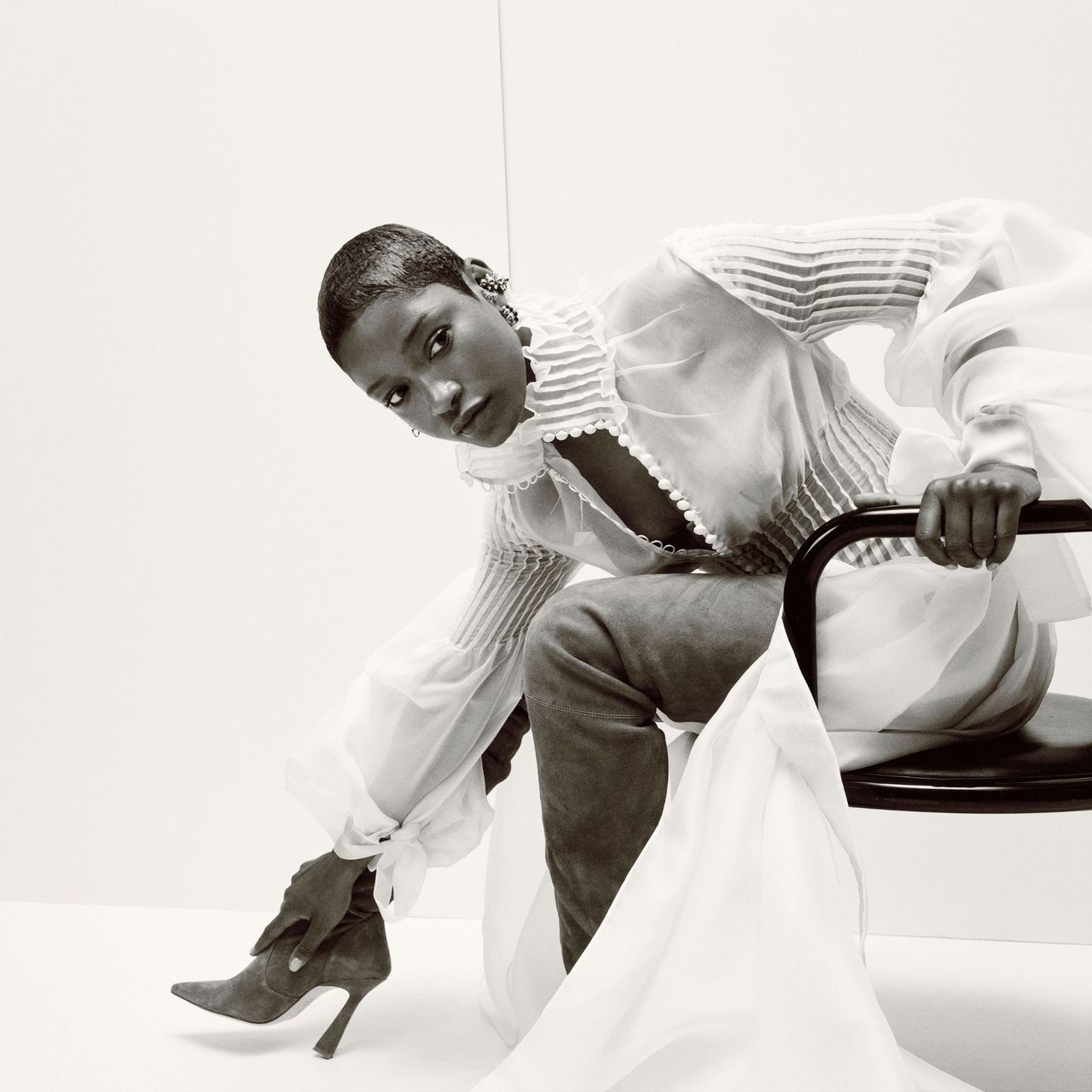 Keke Palmer wearing white dress and jeans for Marie Claire's Mogul Issue