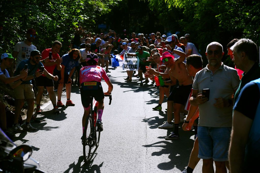 TURIN ITALY MAY 21 Juan Pedro Lpez of Spain and Team Trek Segafredo Pink Leader Jersey competes to retain the overall classification while fans cheer during the 105th Giro dItalia 2022 Stage 14 a 147km stage from Santena to Torino Giro WorldTour on May 21 2022 in Turin Italy Photo by Tim de WaeleGetty Images