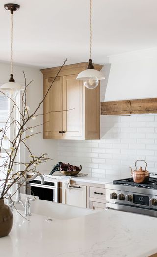 a classic kitchen with a cooker hood with reclaimed wood