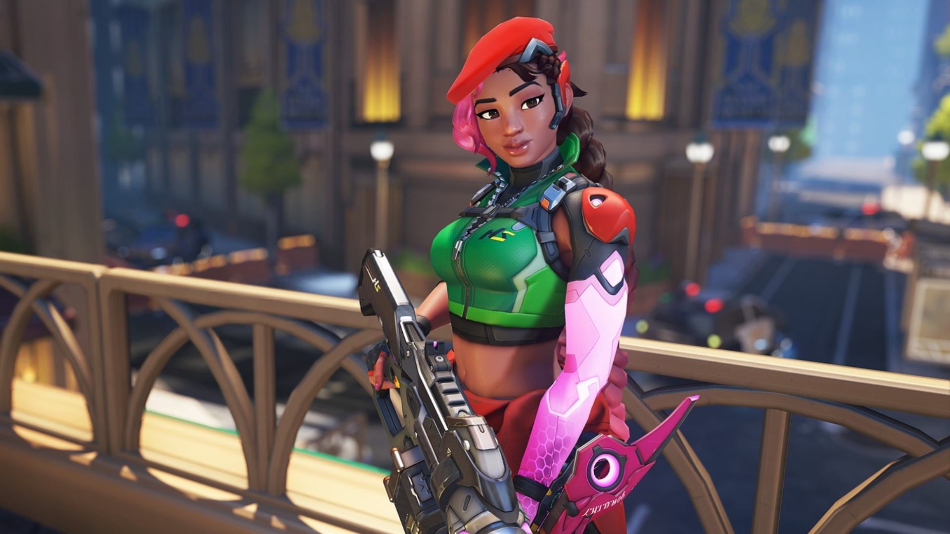 Overwatch tier list: Sierra standing side-on somewhat, holding her rifle down, against a backdrop of Midtown.