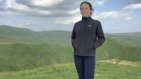 HIker in black jacket with hands in pockets