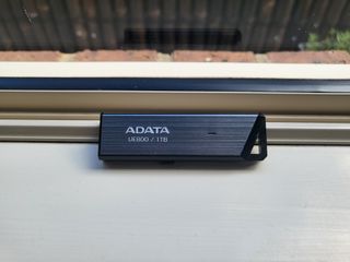 Adata UE800 1TB SSD on a window sill during our test and review process