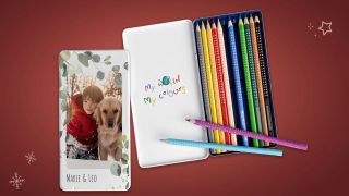 The lid of a Faber-Castell pencil features a photo of a small boy with his dog.