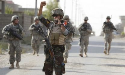 A Kurdish soldier with U.S. troops during a patrol in Kirkuk, Iraq