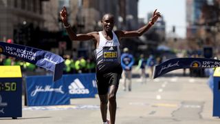 a photo of Chebet winning the Boston Marathon 22