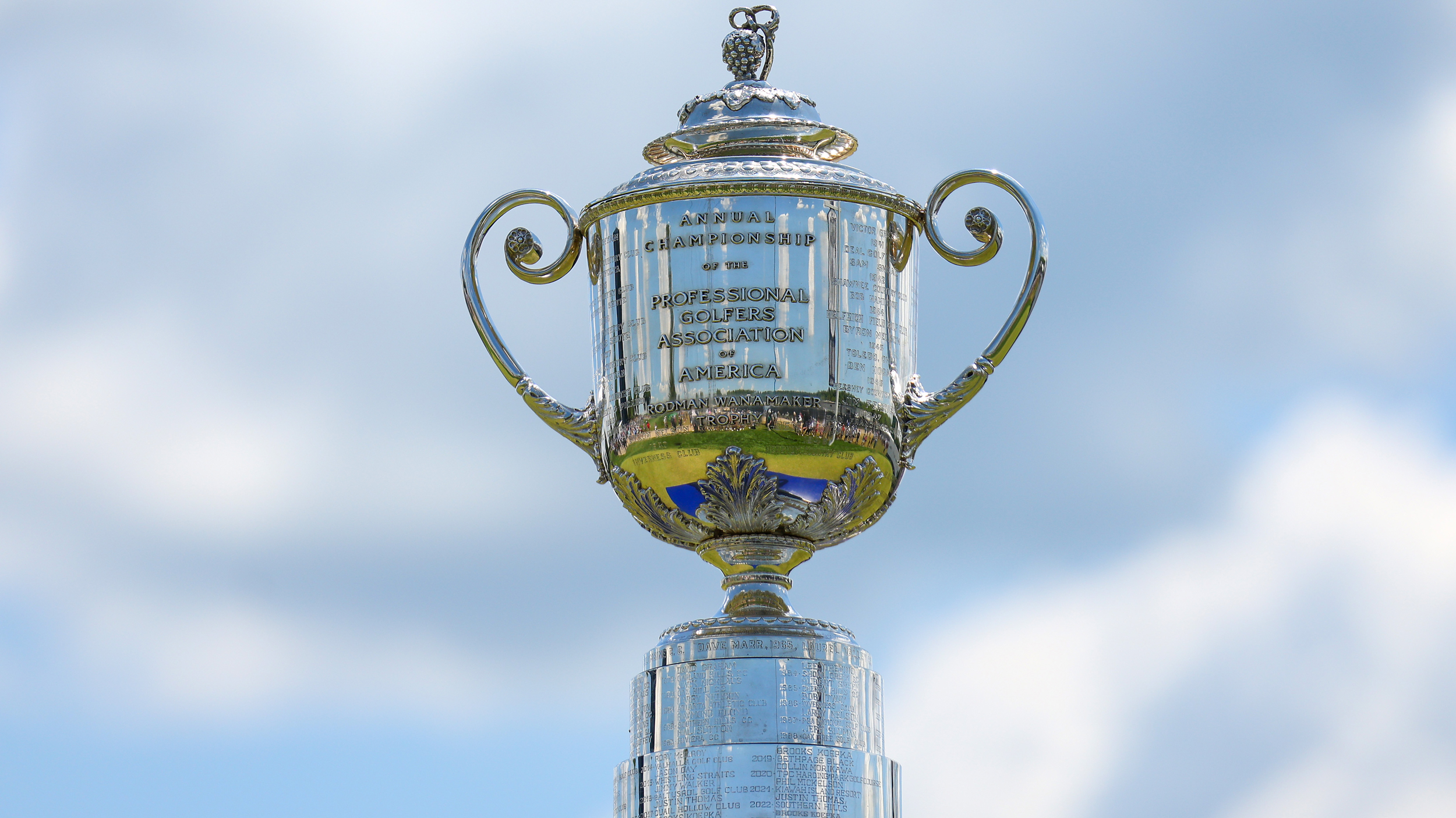 The Wanamaker Trophy seen against a blue and cloudy sky