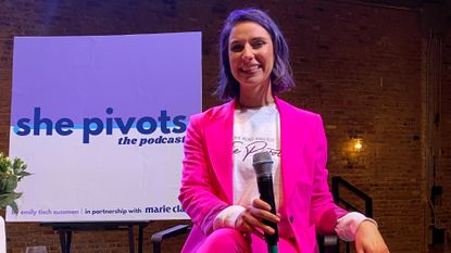 she pivots host Emily Tisch Sussman wearing a sweatshirt