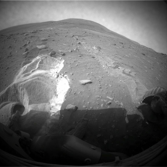 NASA’s Mars Rover Spirit’s wheels slip as the rover attempts to extricate itself from a patch of soft martian soil