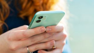 Close view of woman's hands holding phone