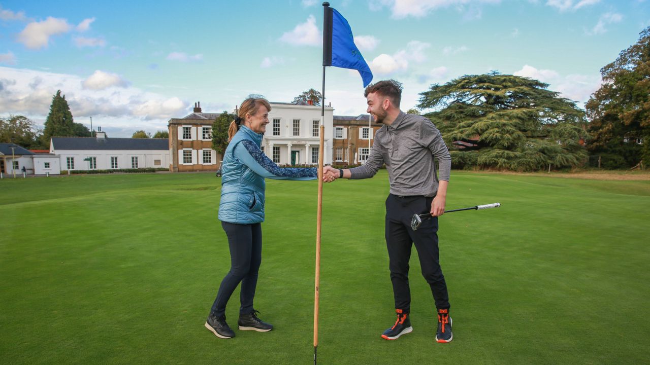 Alison Root and Dan Parker shaking hands