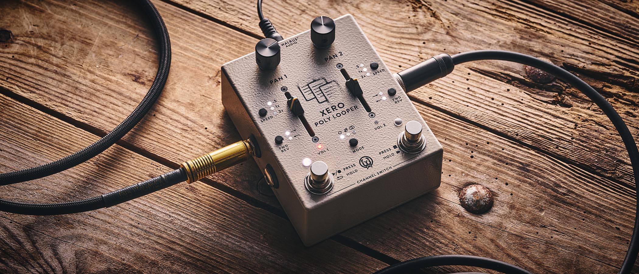 Walrus Audio Xero Polylooper: the dual-slider and footswitch looper is photogaphed against a wooden floor.
