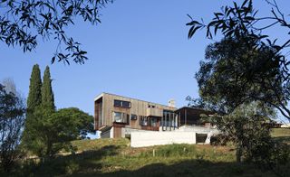The Davenport Wilson house is anchored to the land by a series of masonry terraces built into the sloping ground