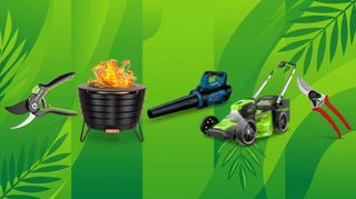 A selection of garden tools on a green, leafy background.