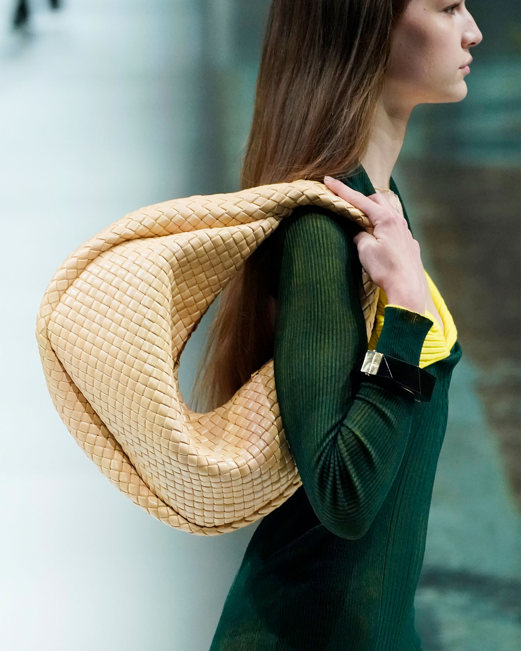 model holding Bottega Veneta bag