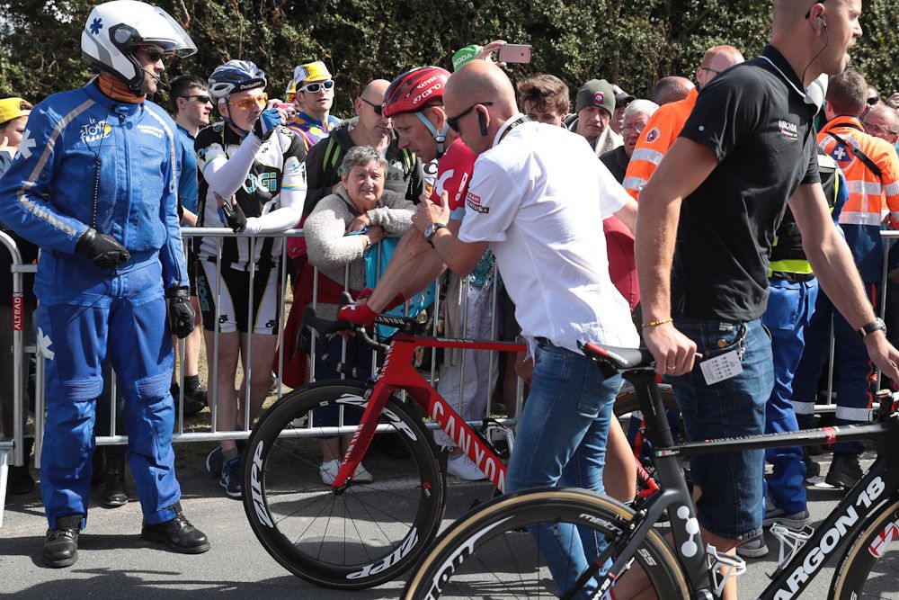Michael Morkov reacts after a fall next to his teammate Austria's Marco Haller (R) during the 188 km first stage of the 103rd edition of the Tour de France