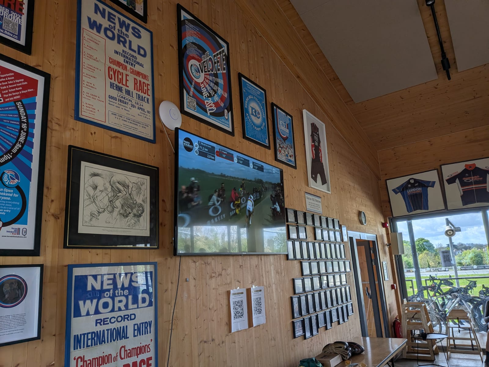 Wall with photos and a tv