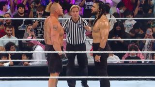 Brock Lesnar and Roman Reigns in the ring.