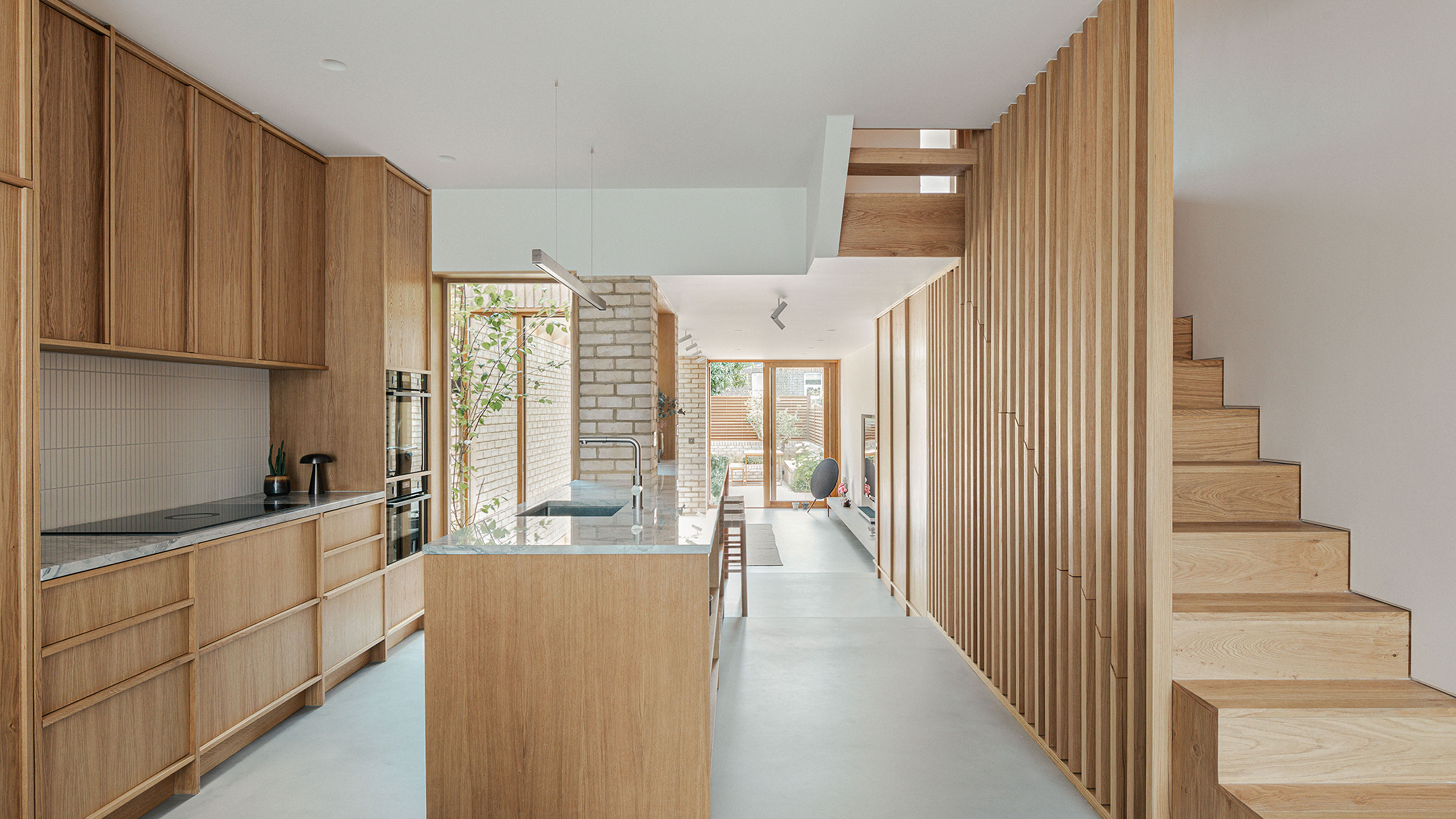 L-shaped kitchen extension with wooden kitchen