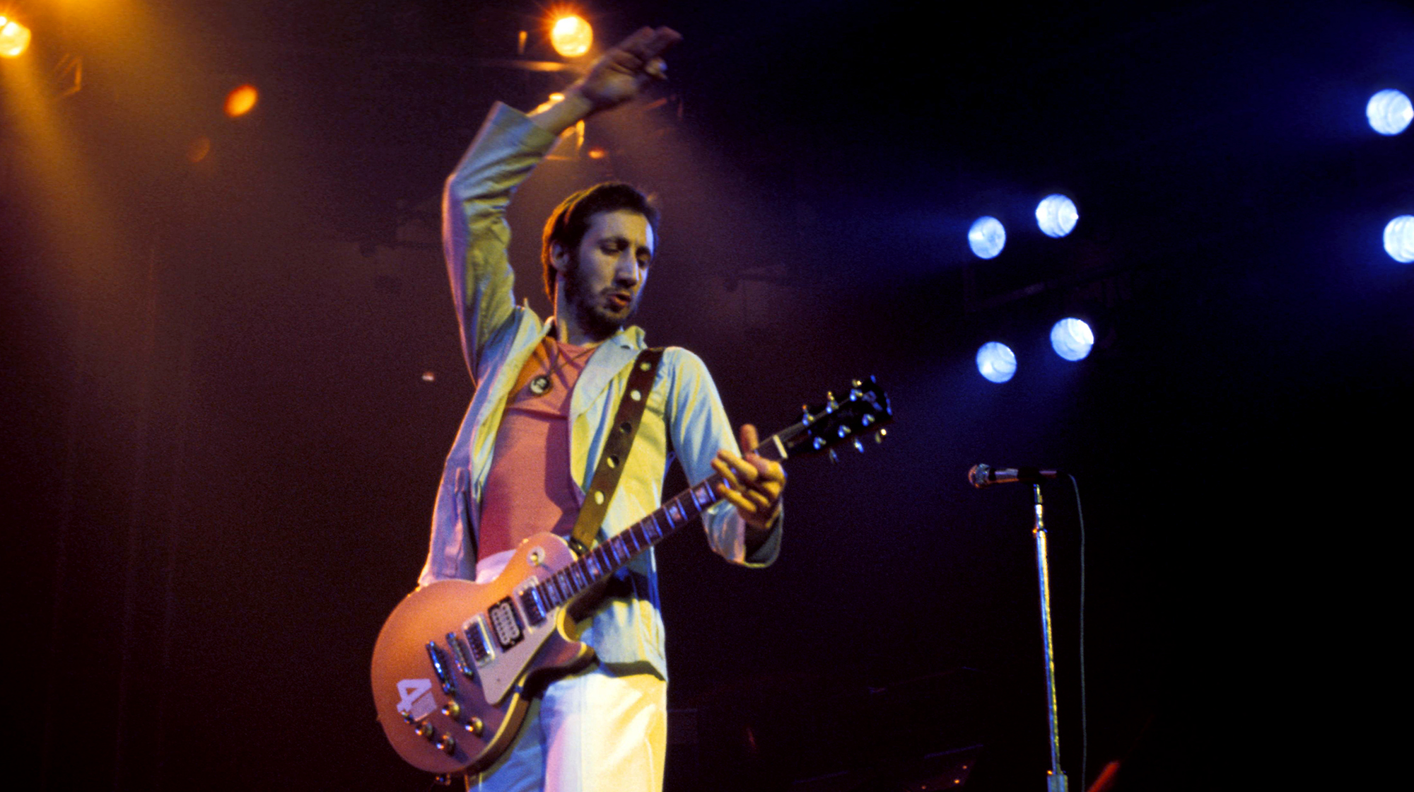 The Who, Pete Townshend performing live onstage, playing Gibson Les Paul Deluxe guitar, doing 'windmill' arm, at Madison Square Garden, 1976