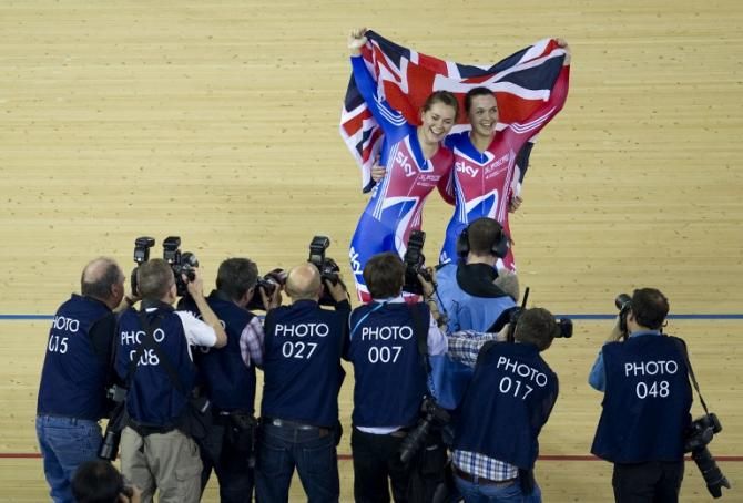 Great Britain's Jess Varnish (L) and Victoria Pendleton (R) celebrate winning the Women's Team Sprint Final at the UCI World Cup in London