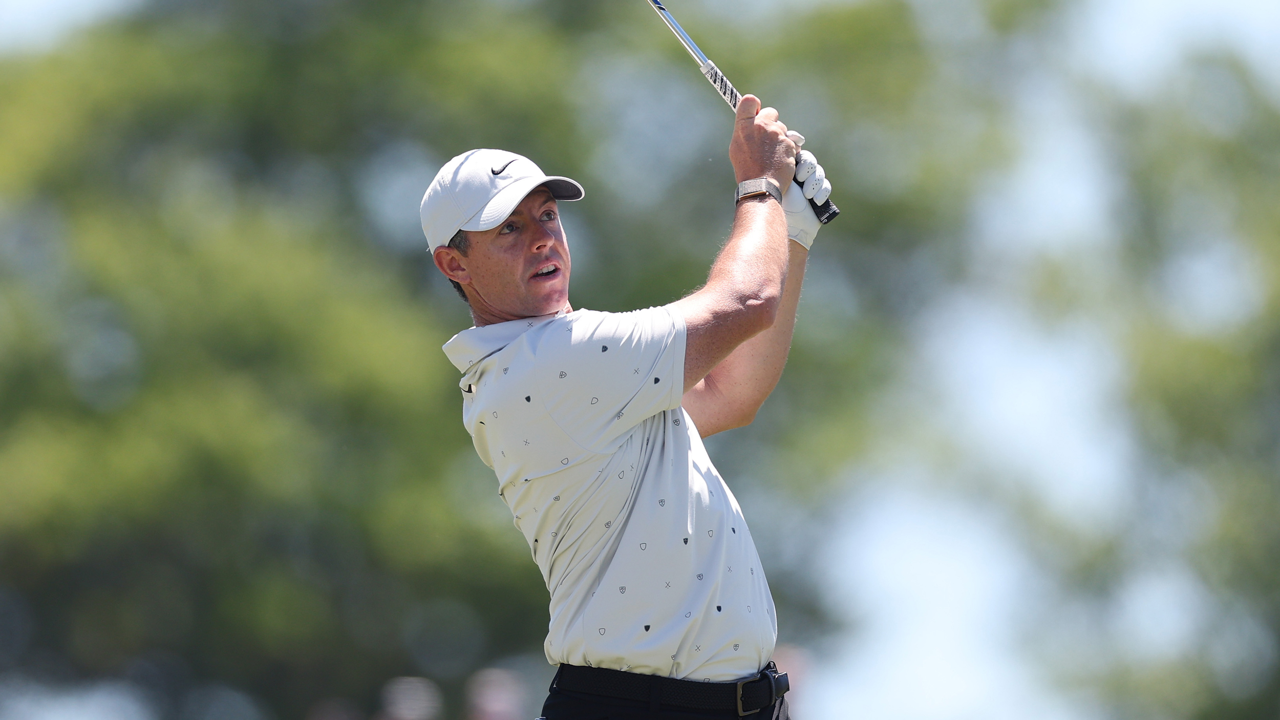 Rory McIlroy holds his finish on an iron shot