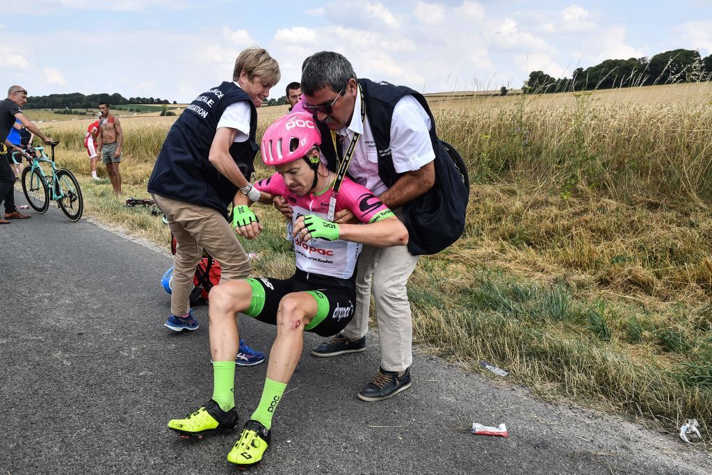 Simon Clarke (EF-Drapac) is helped up after a crash
