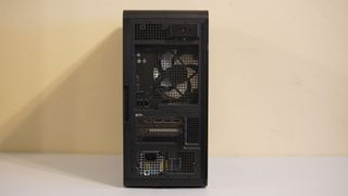 An Alienware Aurora gaming desktop on a desk with its back ports showing