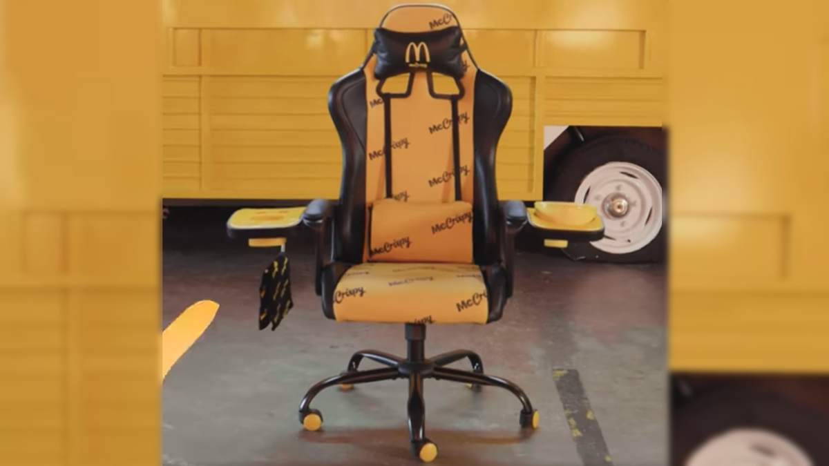 McDonald&#039;s McCrispy Ultimate Gaming Chair on a yellow background with fries holder and hot box attachments.