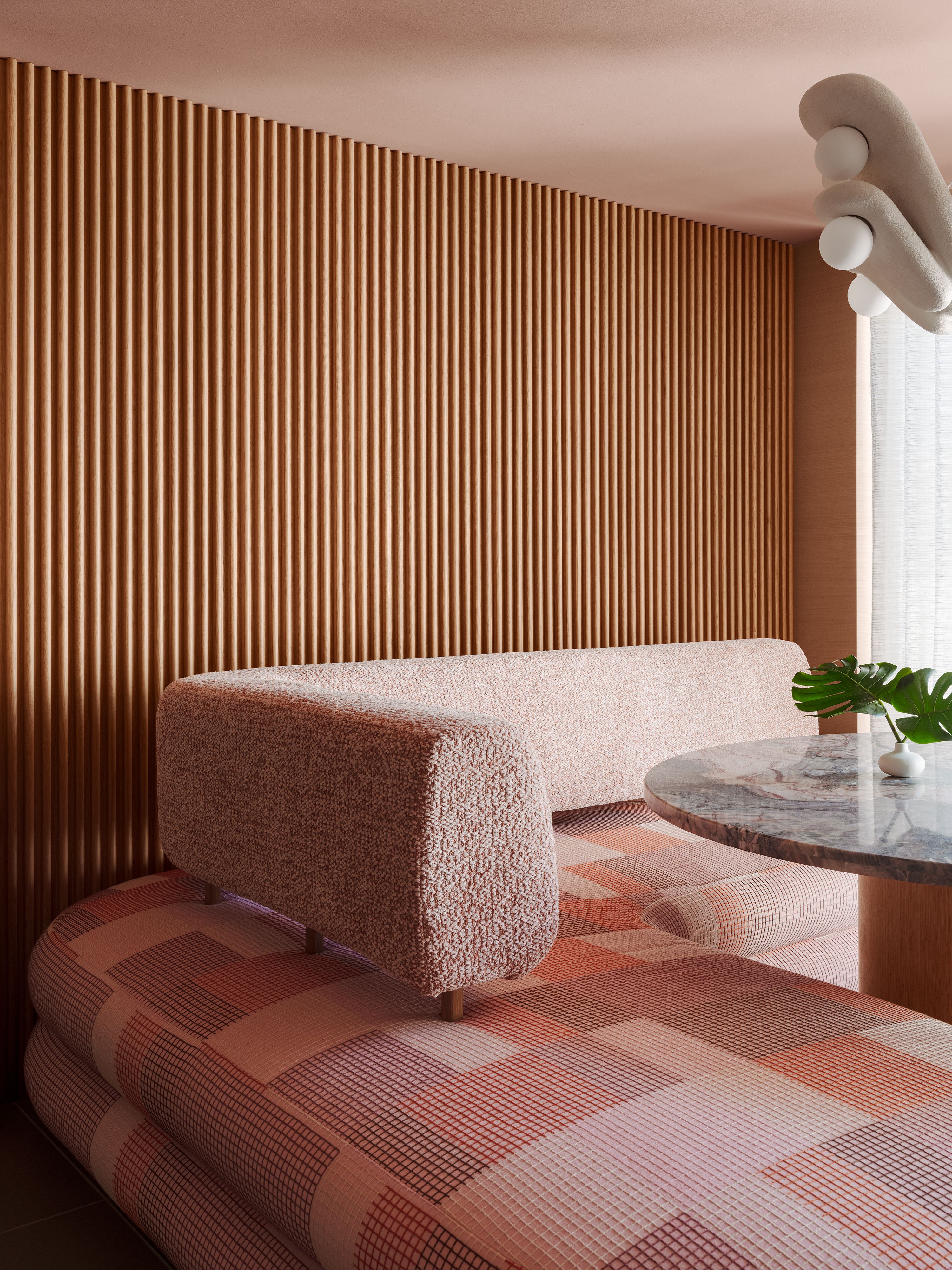 Close up of pink banquette seating