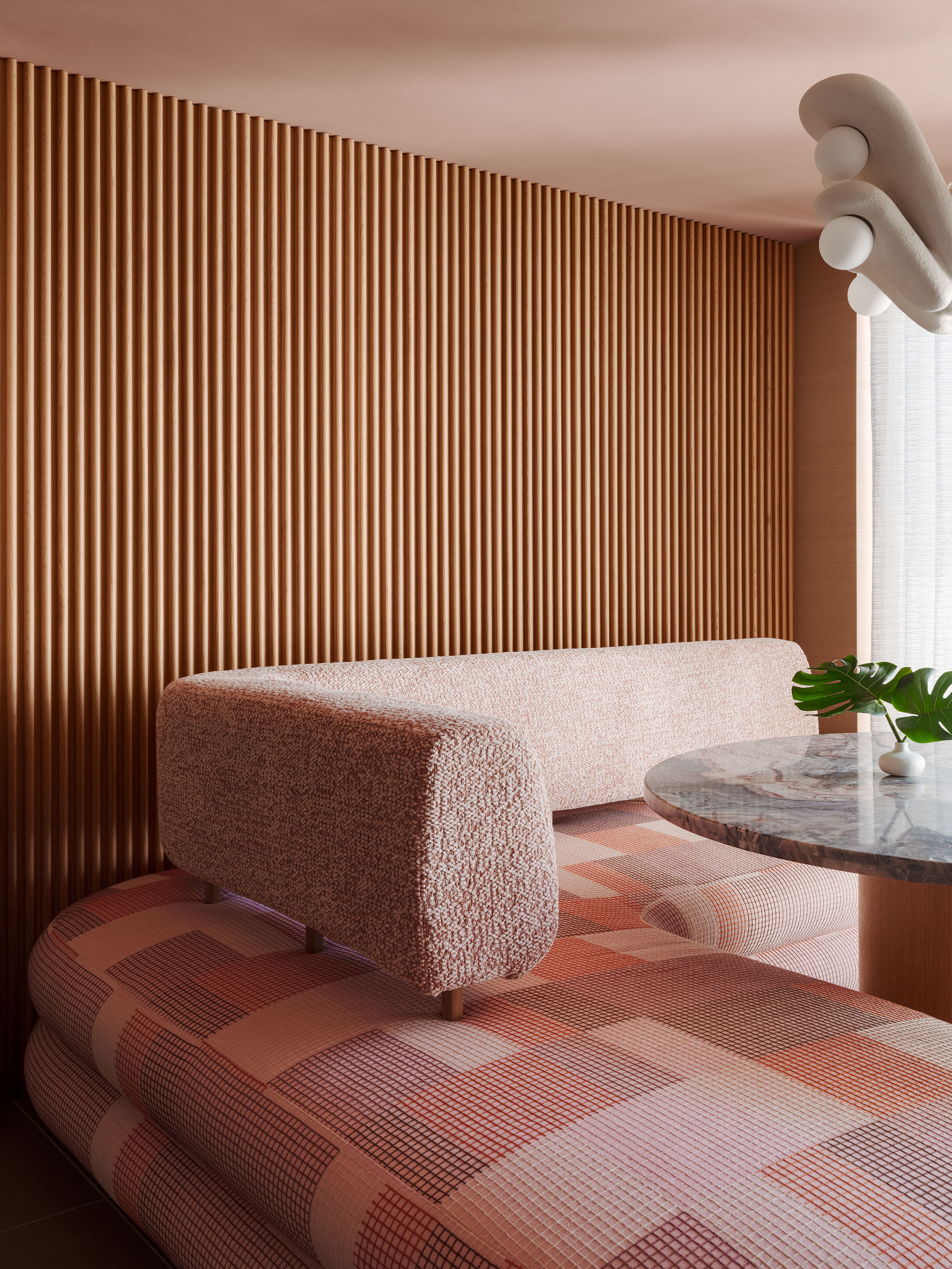 Close up of pink banquette seating
