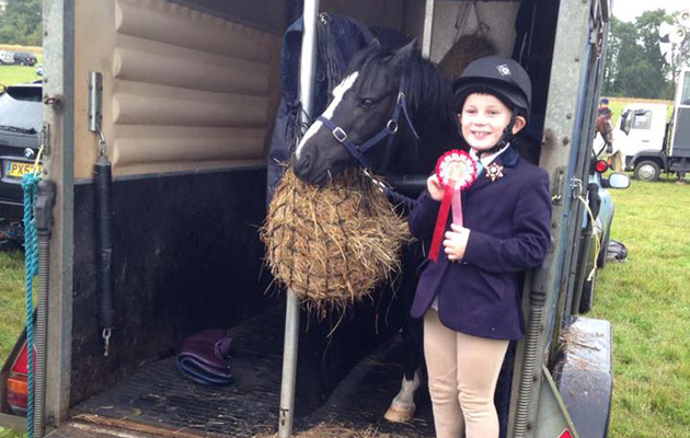 Ben then 7 with Flash after coming first in lead rein jumping at the extremely wet Quantock show last year!