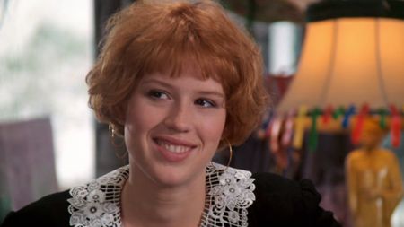 A close up of Molly Ringwald smiling in Pretty in Pink