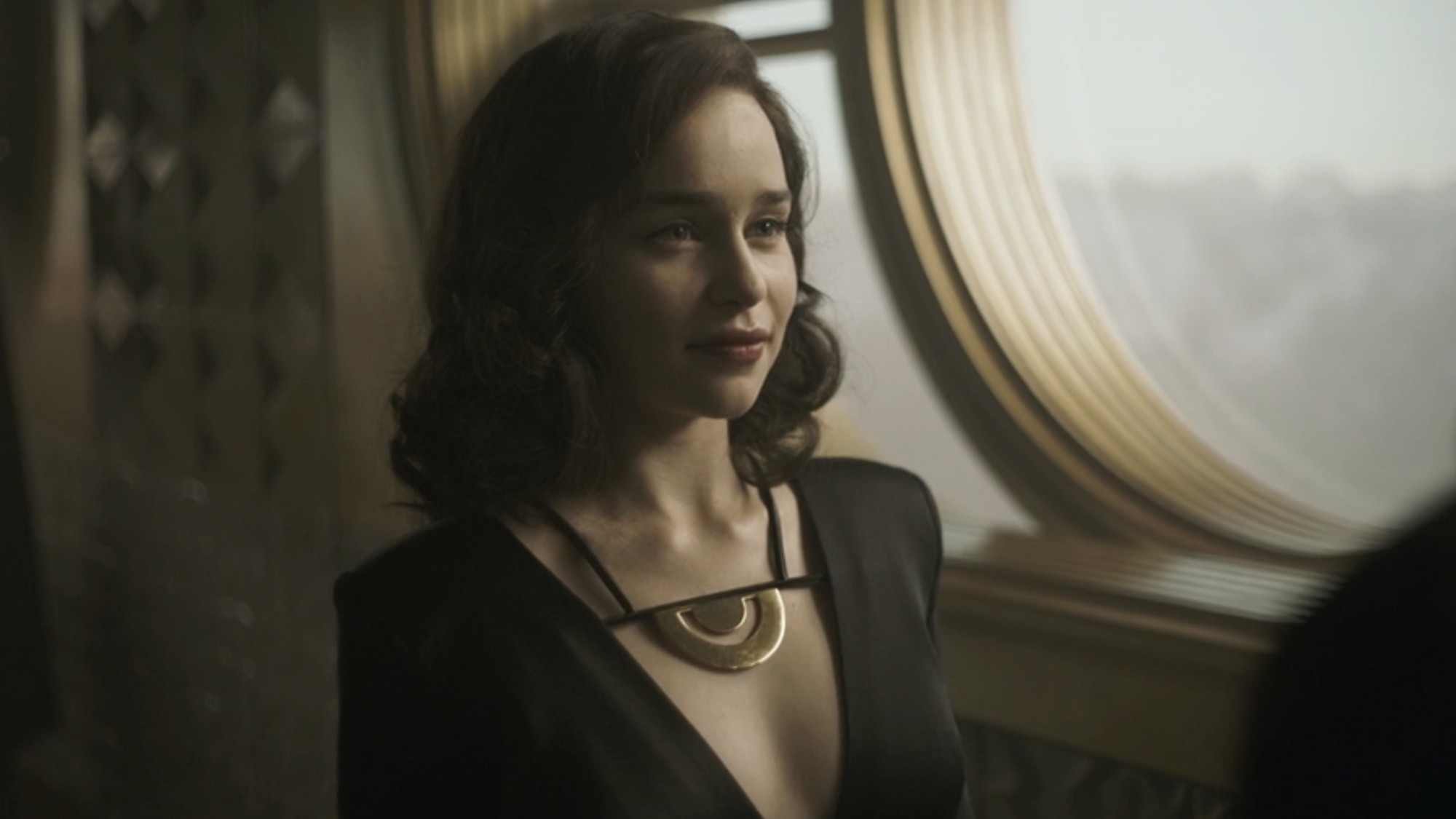 Qi'ra in a low-cut dress reuniting with Han.
