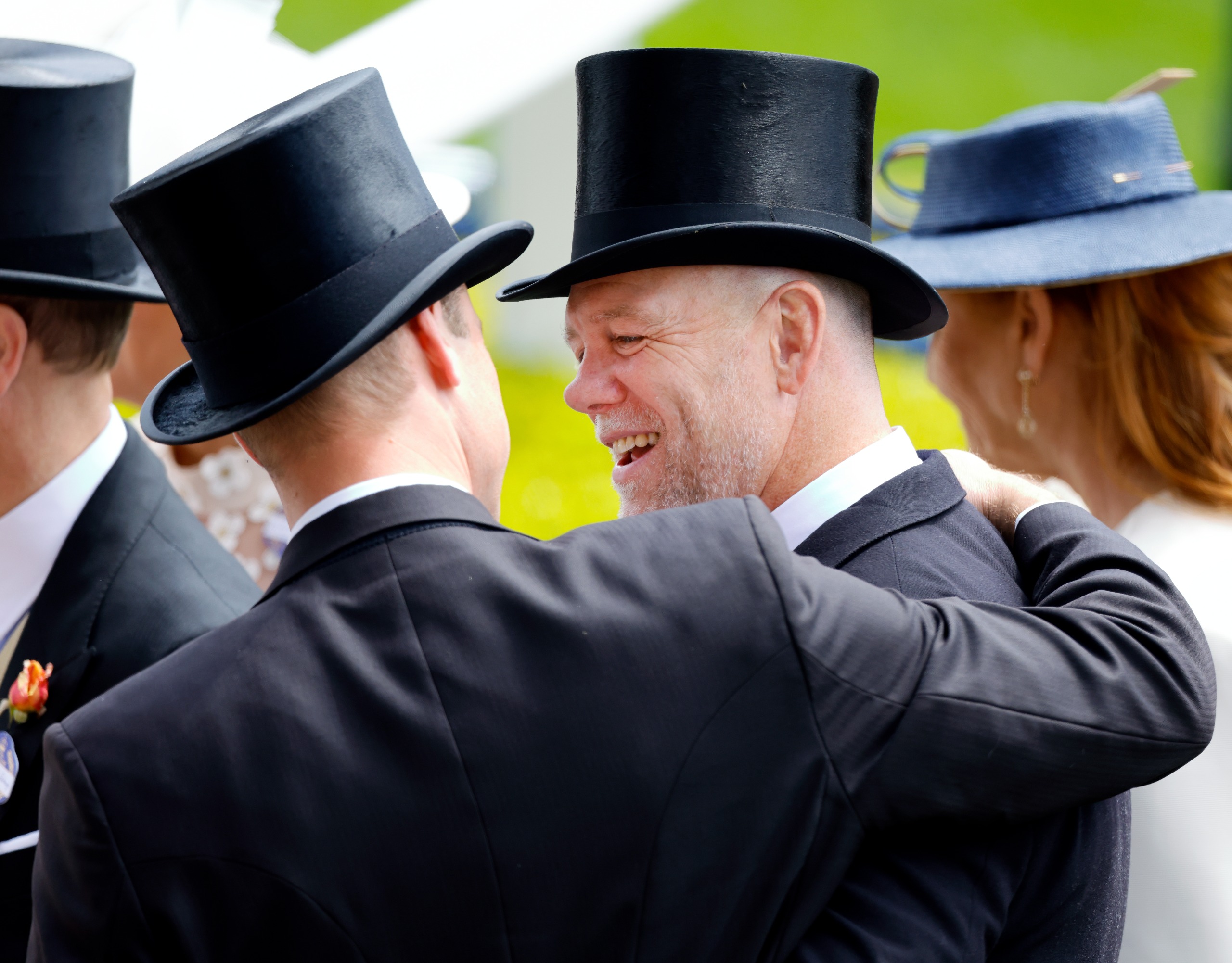 Prince William putting his arm around Mike Tindall at Ascot