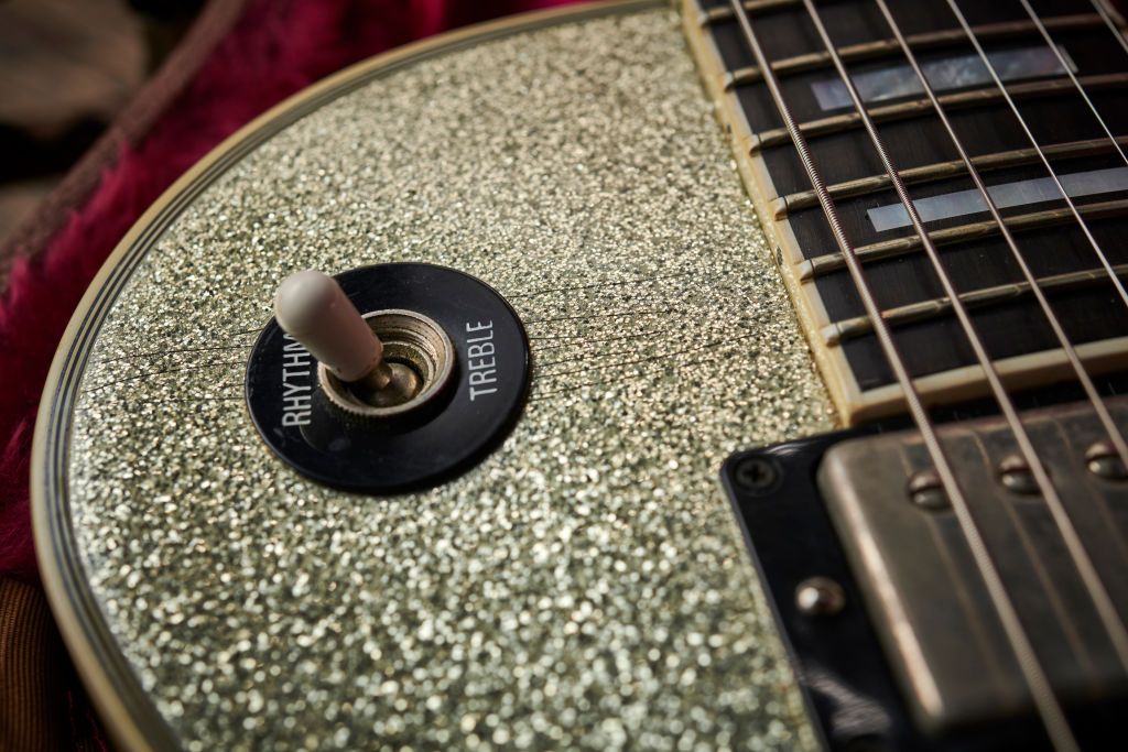 Detail of a 1997 Gibson Les Paul Florentine electric guitar with a Silver Sparkle finish previously owned by Oasis guitarist Noel Gallagher, taken on November 15, 2019