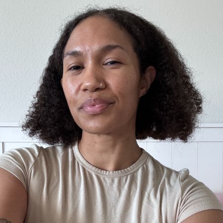 A beauty editor wearing L'Or&eacute;al's Iron Sleek haircare collection