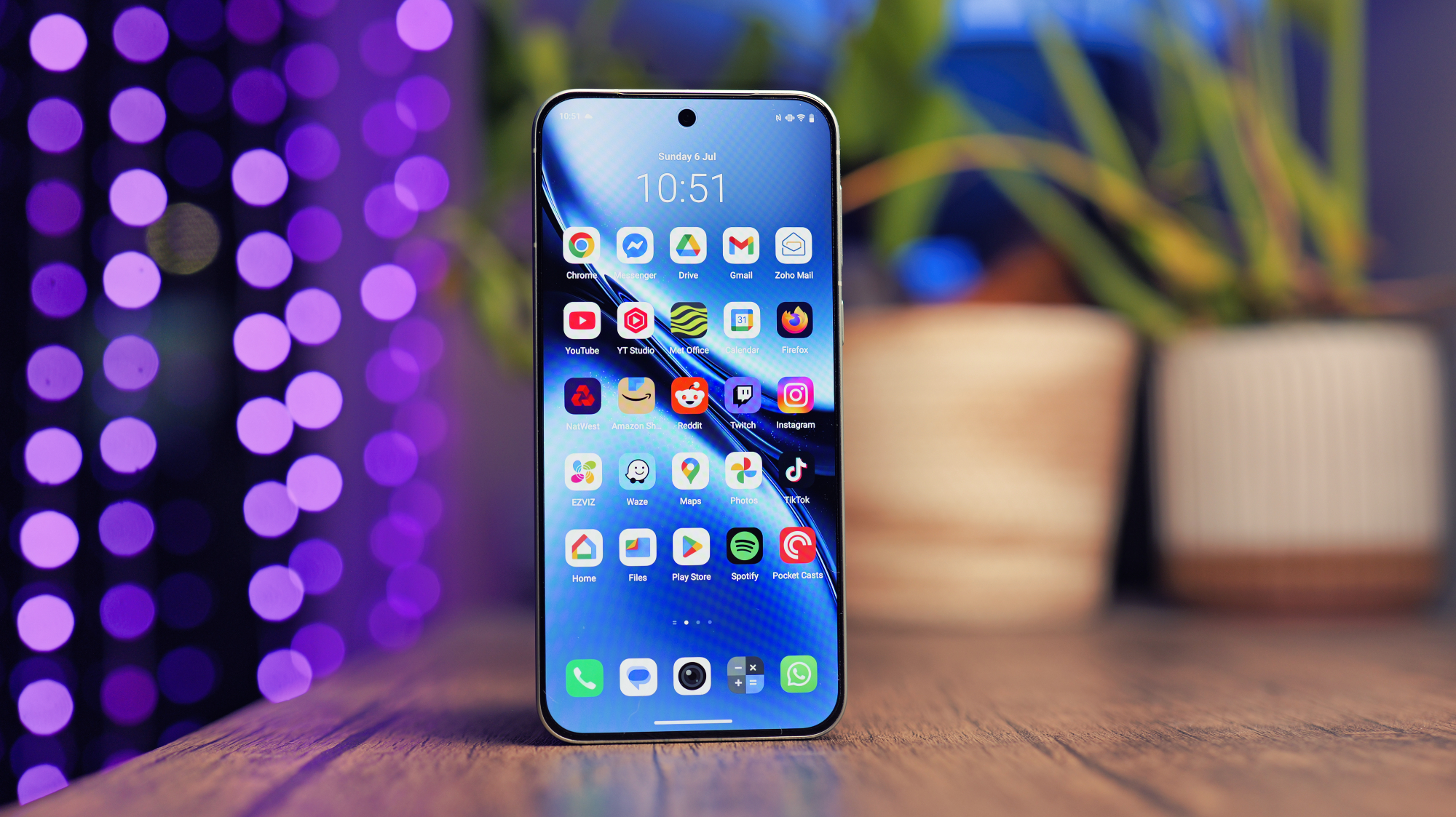Vivo X200 FE phone on a wooden desk