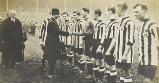 Newcastle United goalkeeper William Bradley shakes hands with King George at Wembley Stadium
