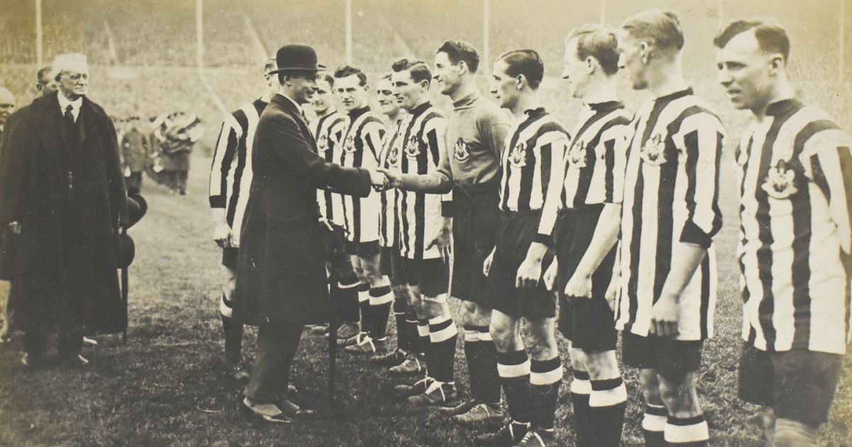 Newcastle United goalkeeper William Bradley shakes hands with King George at Wembley Stadium