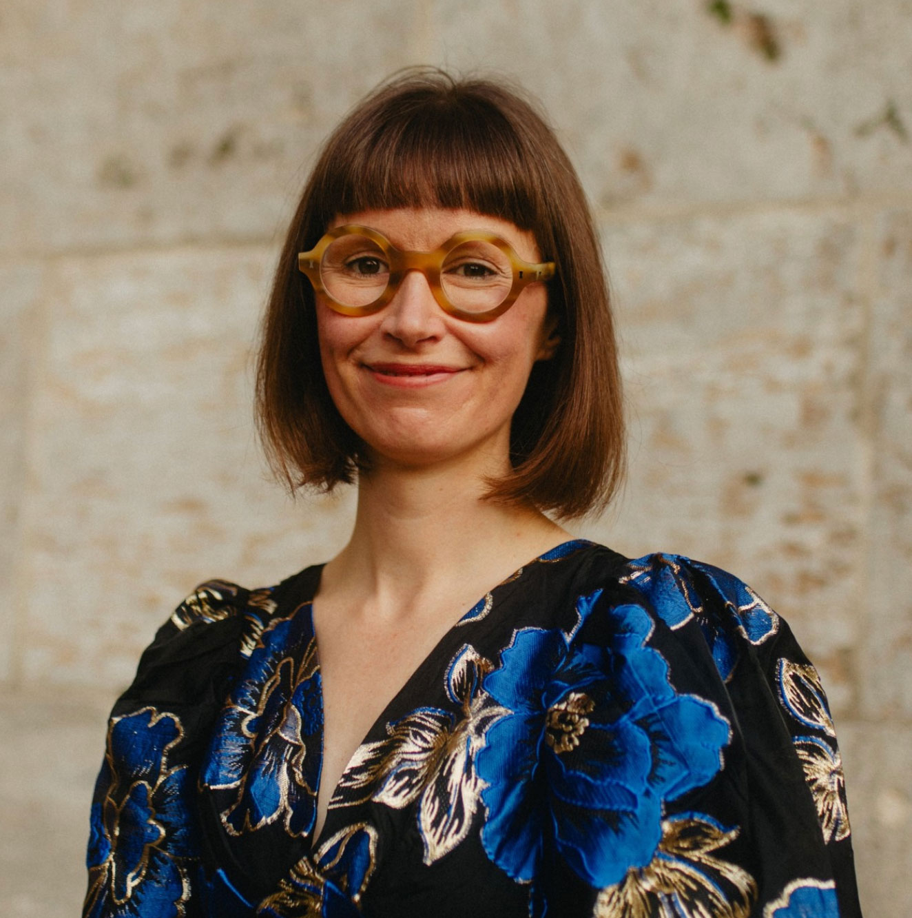 woman in floral dress and glasses