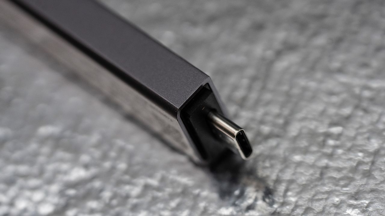 Seagate Ultra Compact SSD on a glass background.