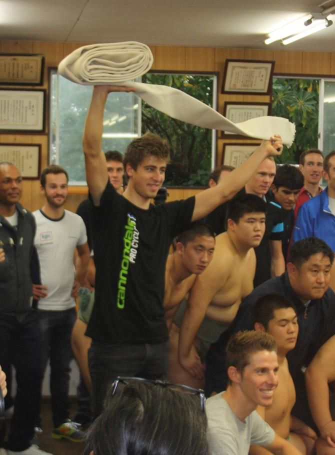 To the victor the spoils. Peter Sagan in celebratory mood in Saitama.