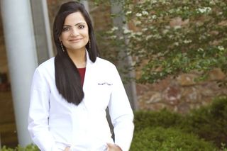 Cancer survivor: Mohiba K. Tareen, 35 wearing white lab coat